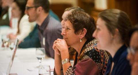 People seated at a table in a networking workshop